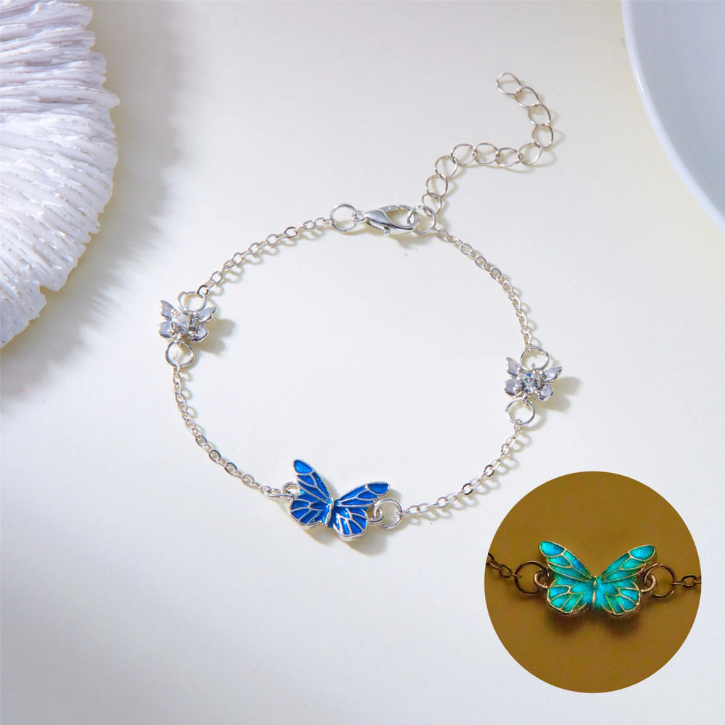 Conjunto de collar y pulsera con dije de mariposa luminosa