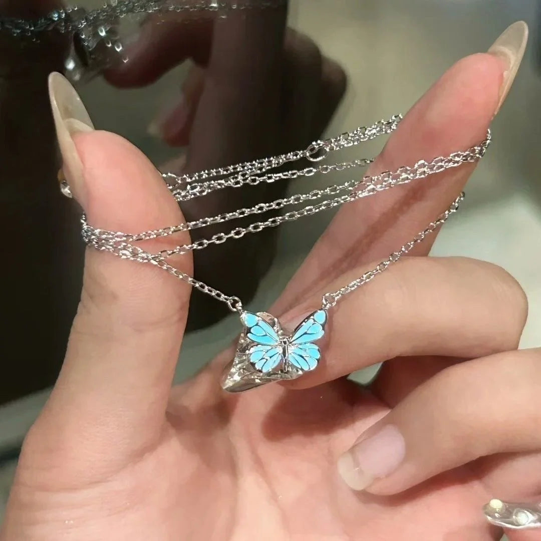 Conjunto de collar y pulsera con dije de mariposa luminosa